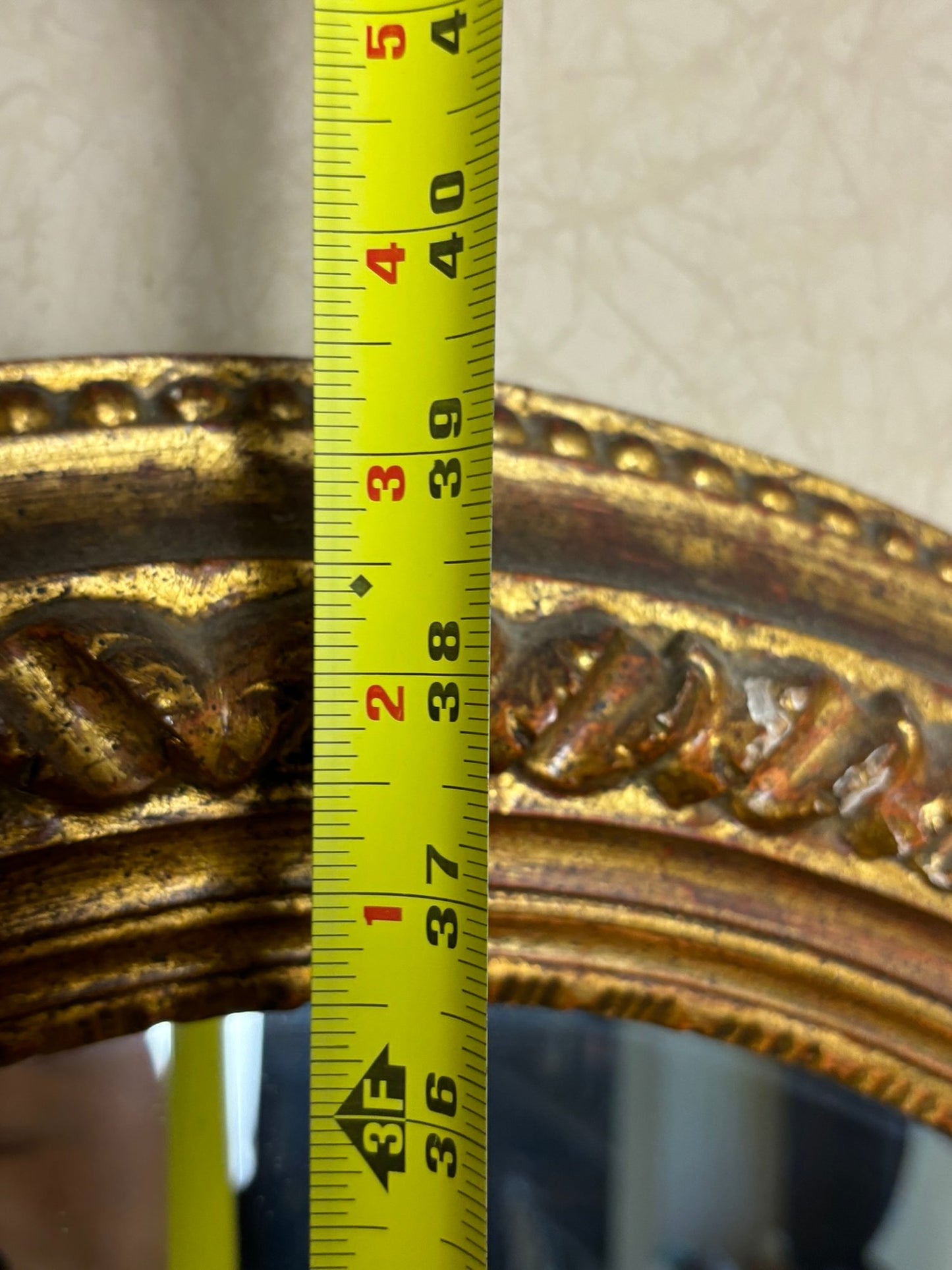 A Vintage Oval Gilt Framed Mirror