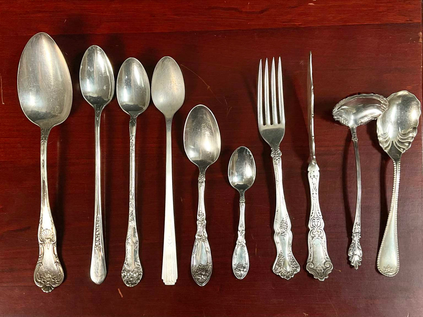 Assortment of Different Patterned Silver Plate Silverware (51 Pieces) in Box
