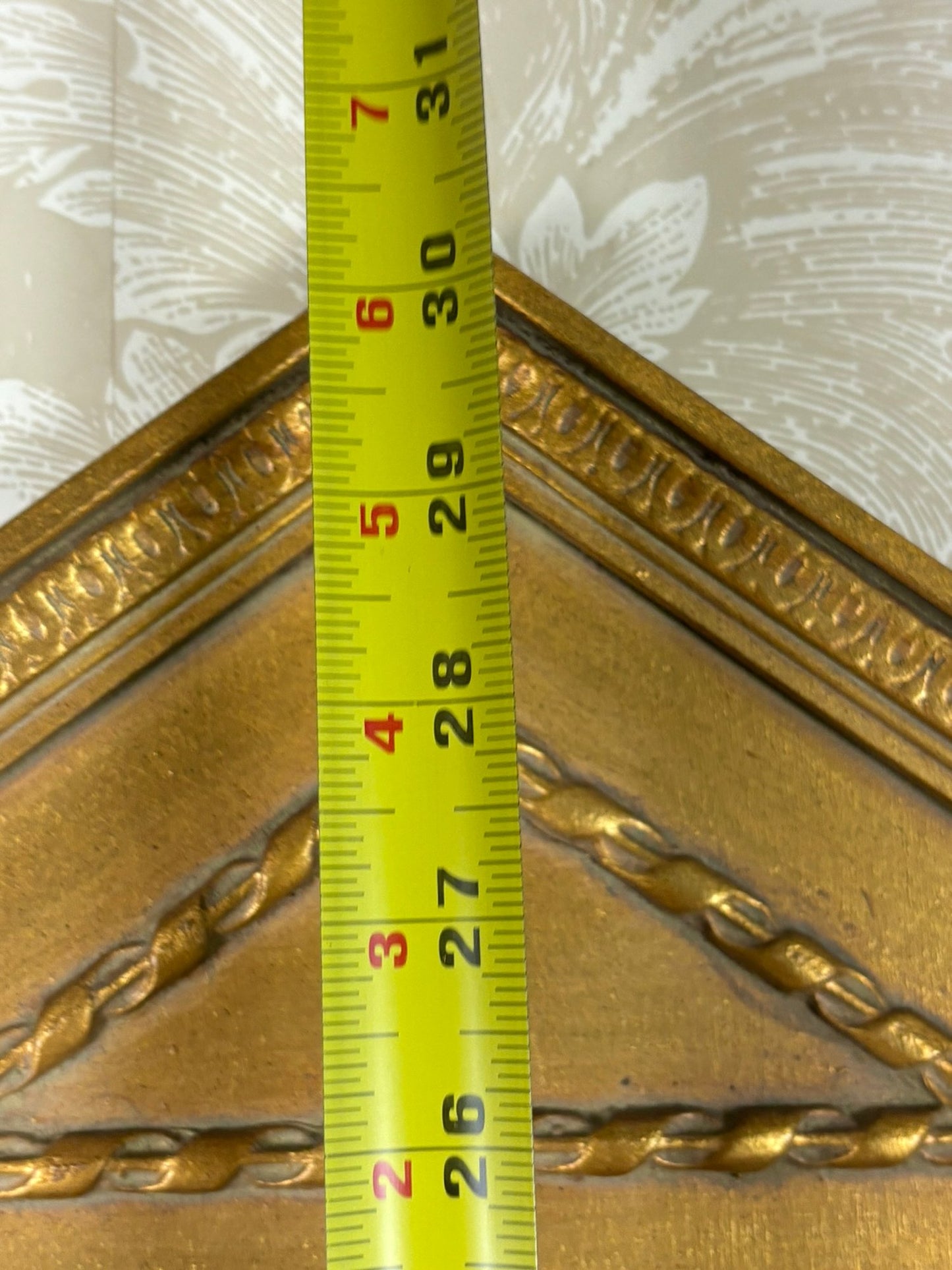A Gilt Framed Mirror With Fluted Column Motif