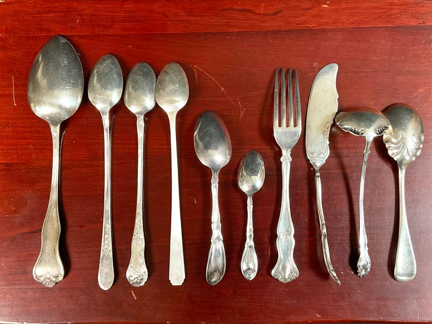 Assortment of Different Patterned Silver Plate Silverware (51 Pieces) in Box