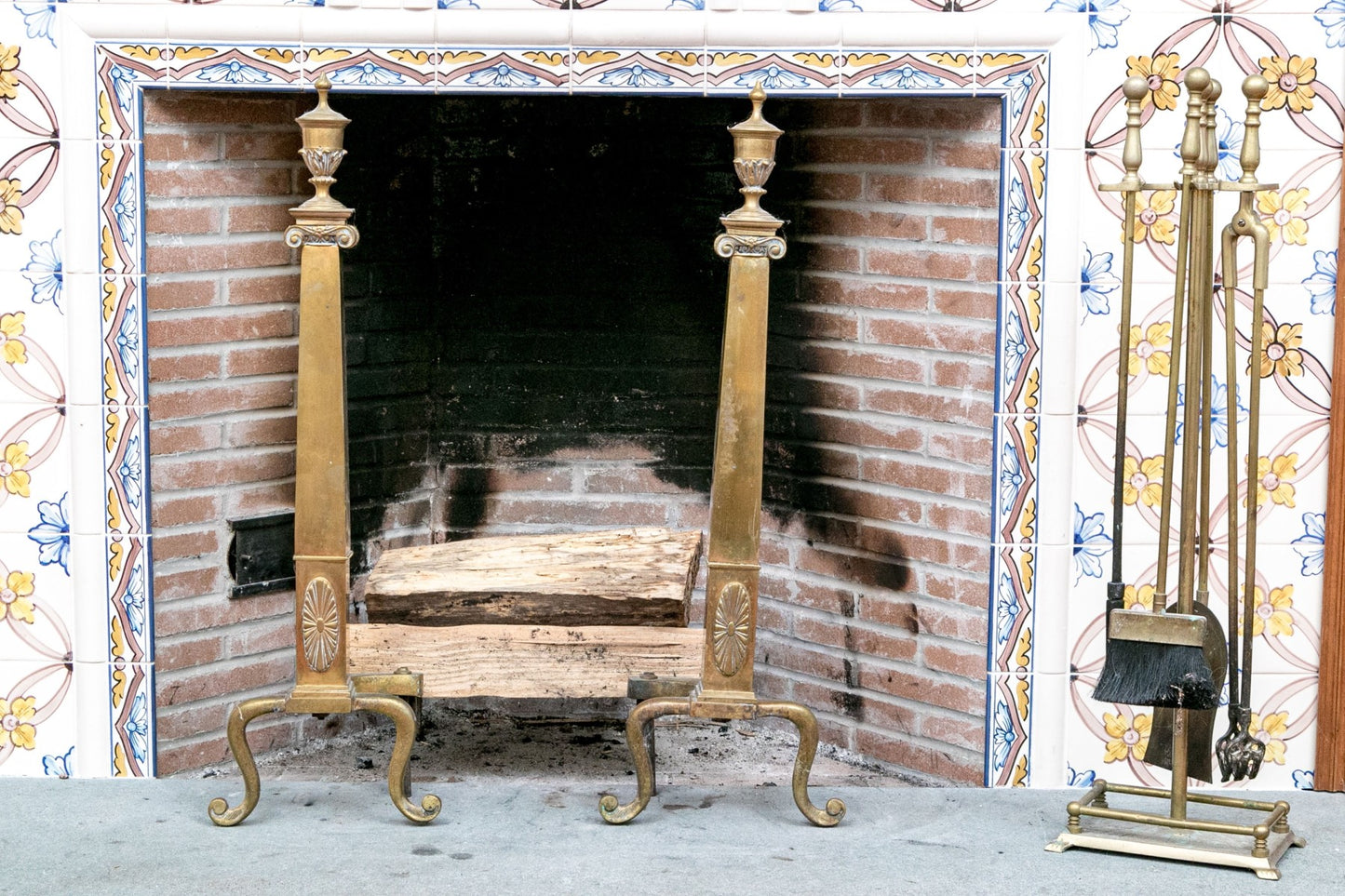 A wonderful collection of antique brass fireplace accessories