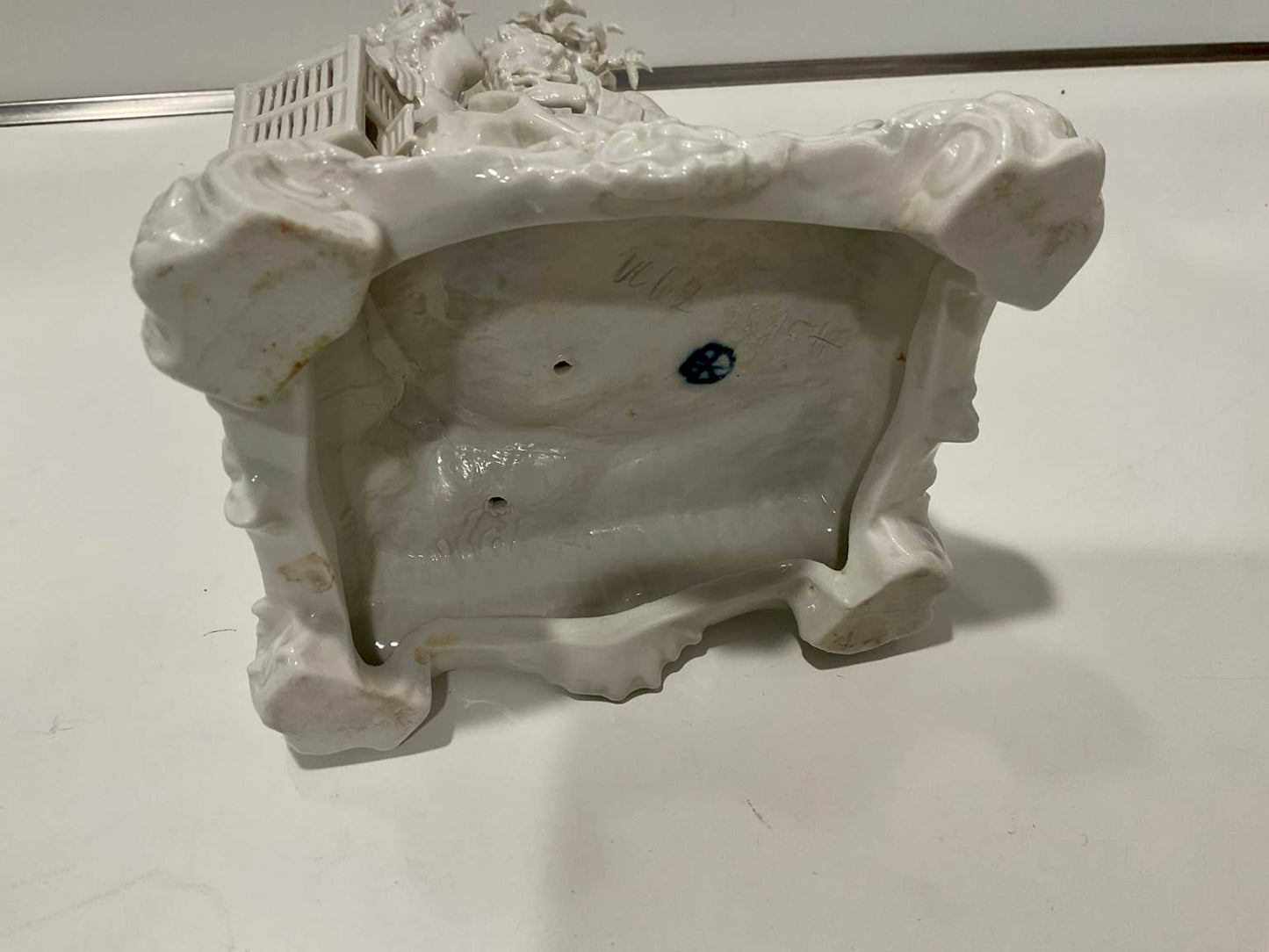 White Porcelain Sculpture of Man Courting Woman in Garden